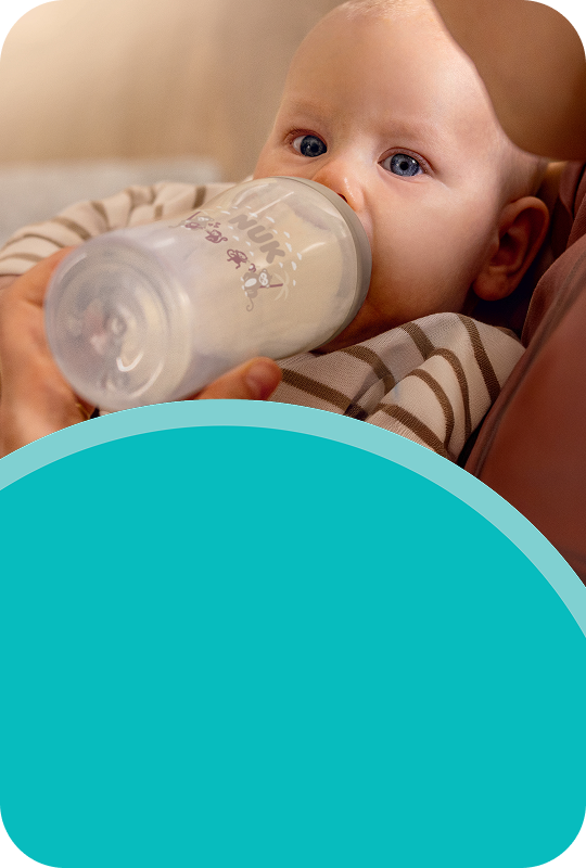Baby with baby bottle