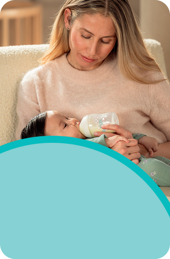 Parent with baby and baby bottle