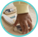Baby hand grabbing a toy