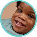 Baby smiling showing first tooth
