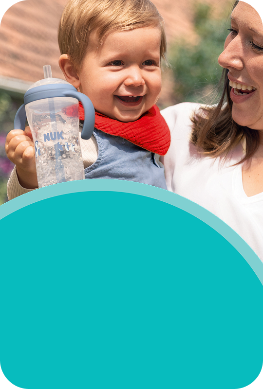 Parent with baby and learner straw cup