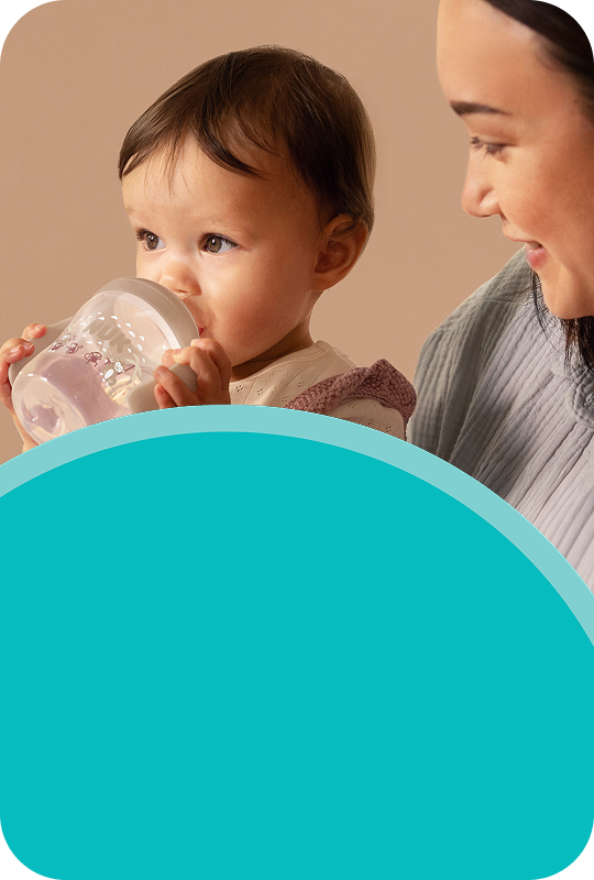 Parent with baby and learner cup